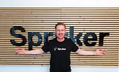 Guido at the Spryker office wall